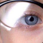 Kid wearing glasses closeup, childhood eye diseases, ophthalmology concept