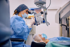 Young physician carrying out a LASIK procedure.